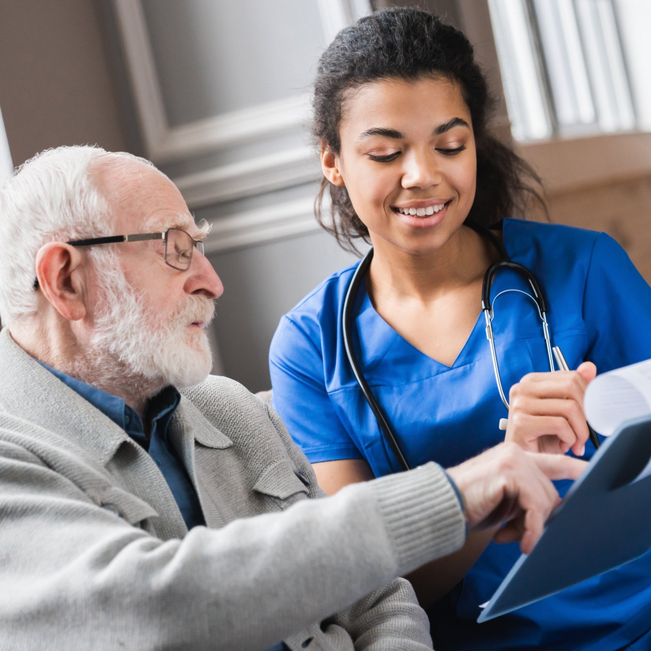 stock-photo-senior-man-elderly-old-patient-and-young-woman-caregiver-medical-worker-in-uniform-hold-clipboard-1952019457-c0690093